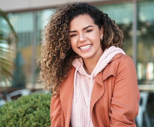 Smiling woman sitting outside