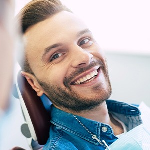 Man smiling at dentist in treatment chair