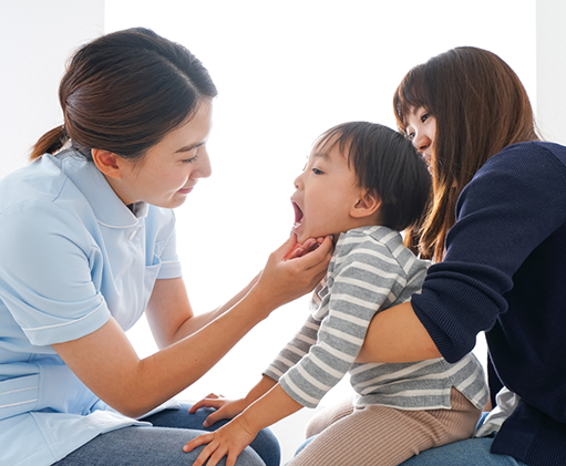 Childrens dentist giving a dental exam to a baby