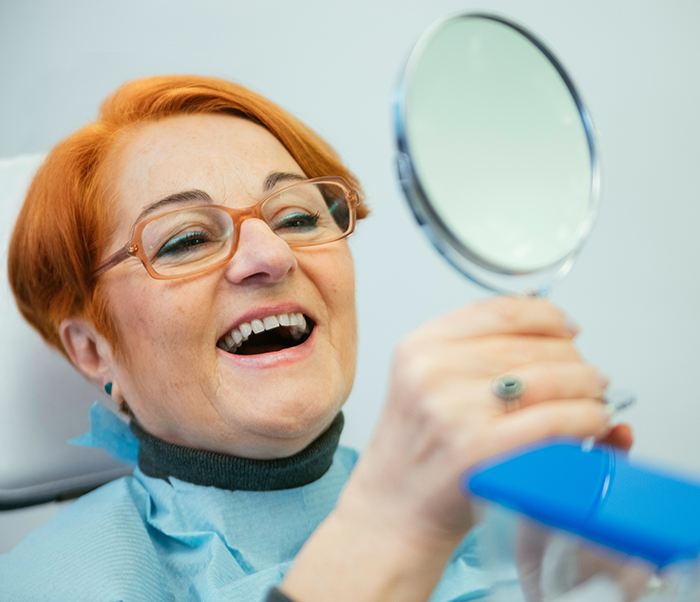 Patient in Justin smiling after dental crown restoration 