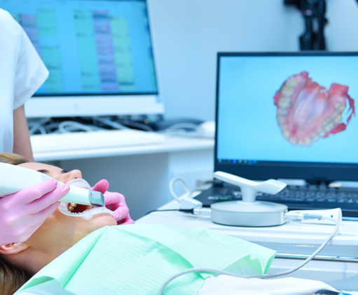 Dental patient having digital impressions taken of her teeth