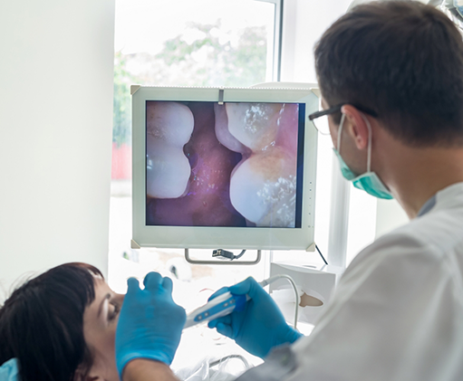 Dentist capturing close up photos of a patients teeth
