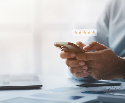 Person typing a five star review on their phone
