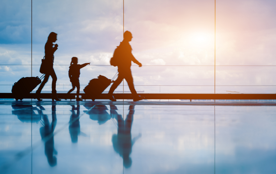 Family walking through airport
